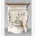Classic beige stone residential fireplace decorated with caryatids